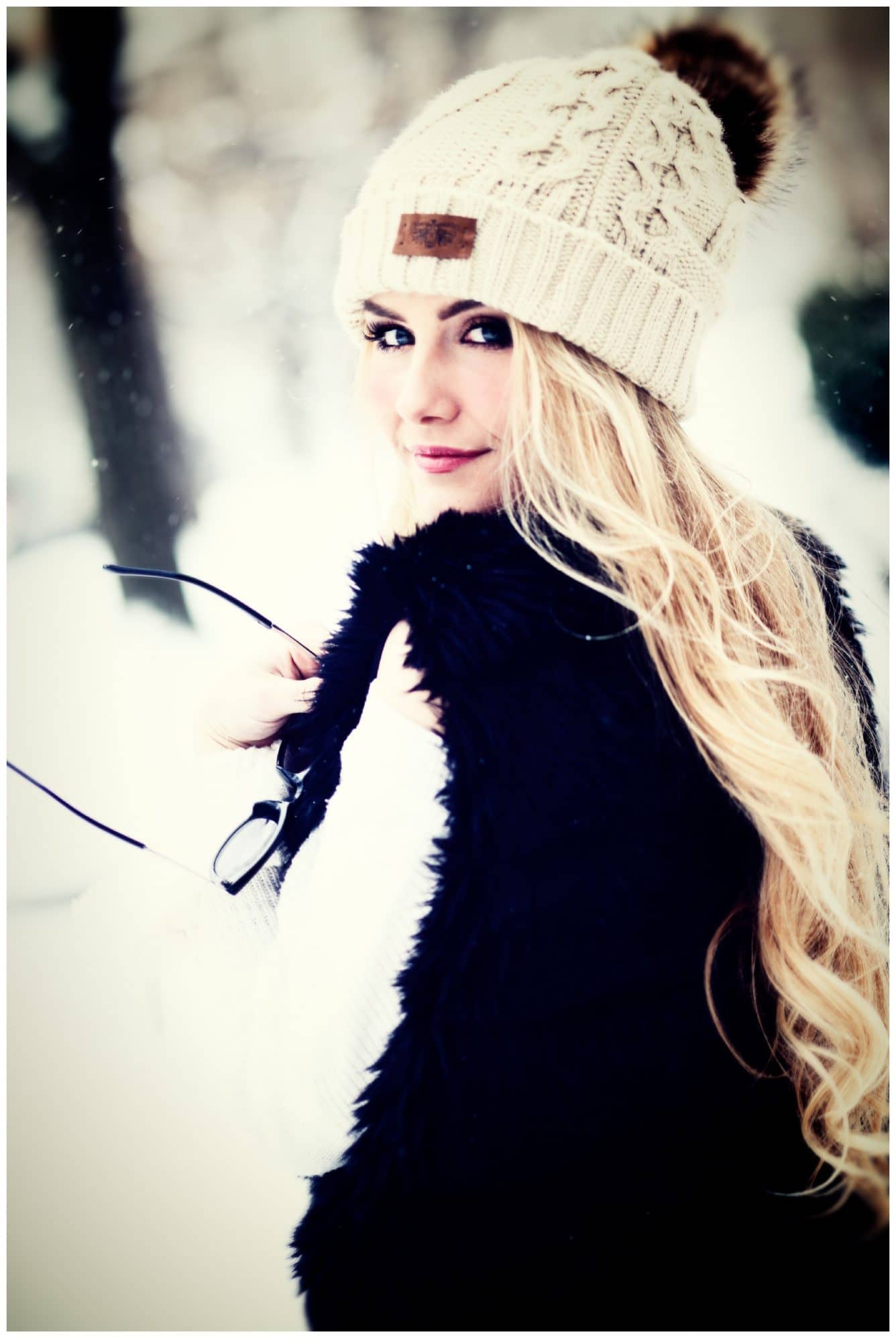 louisville high school senior in white hat in snow