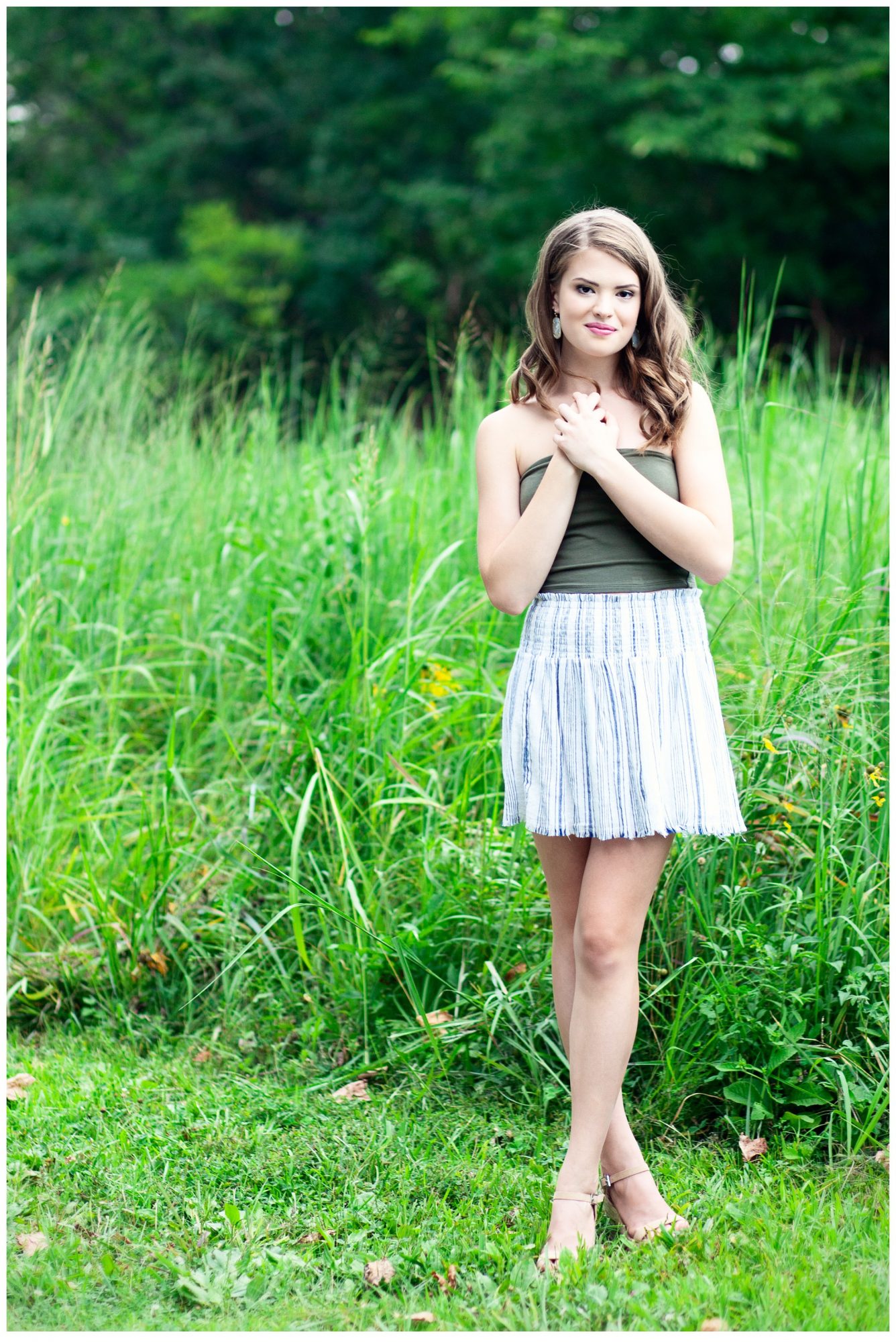 Louisville High School Senior Girl at Blackacre Farm standing in tall grass field.