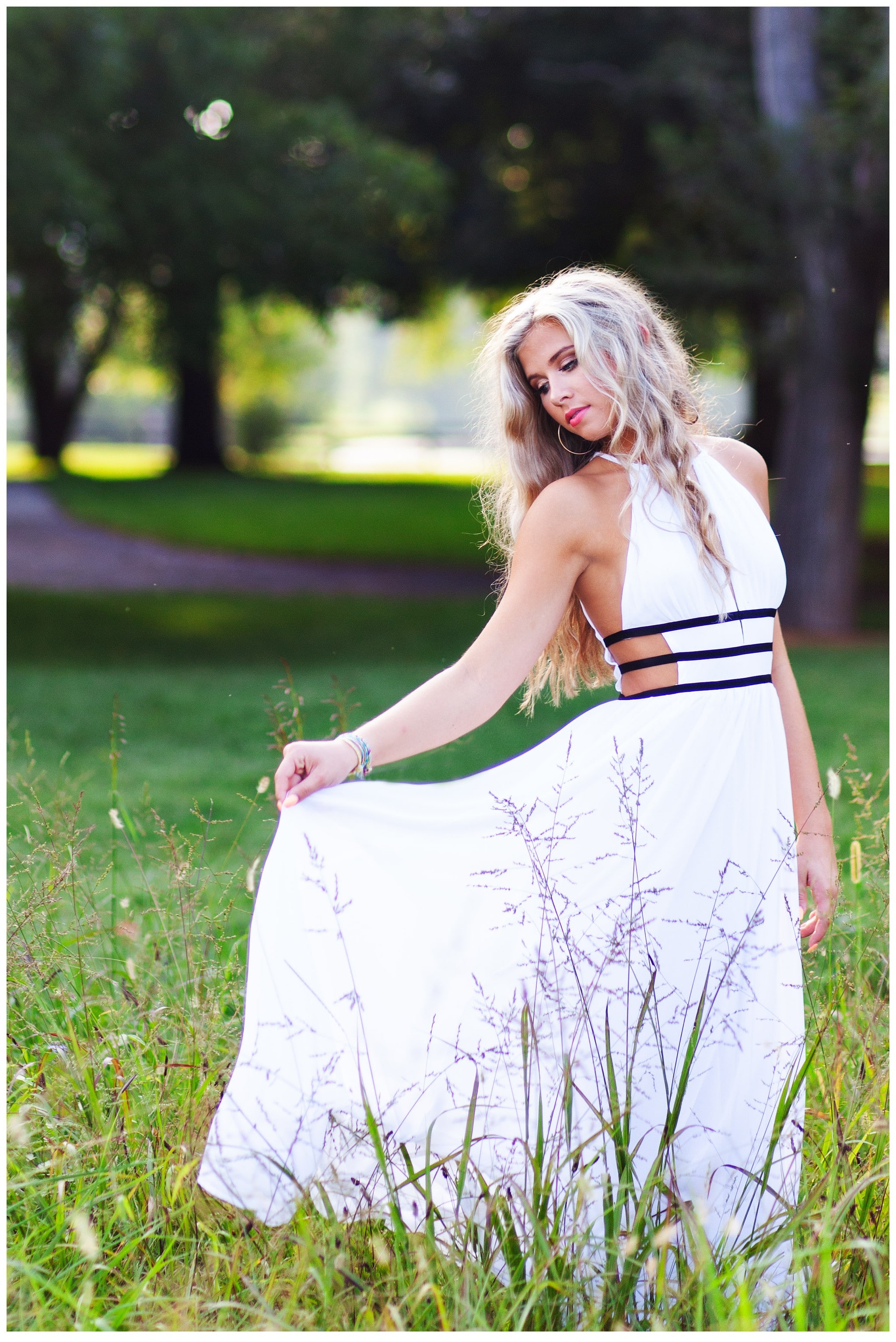Twighlight Senior Session in Louisville KY in a beautiful field of tall grass.