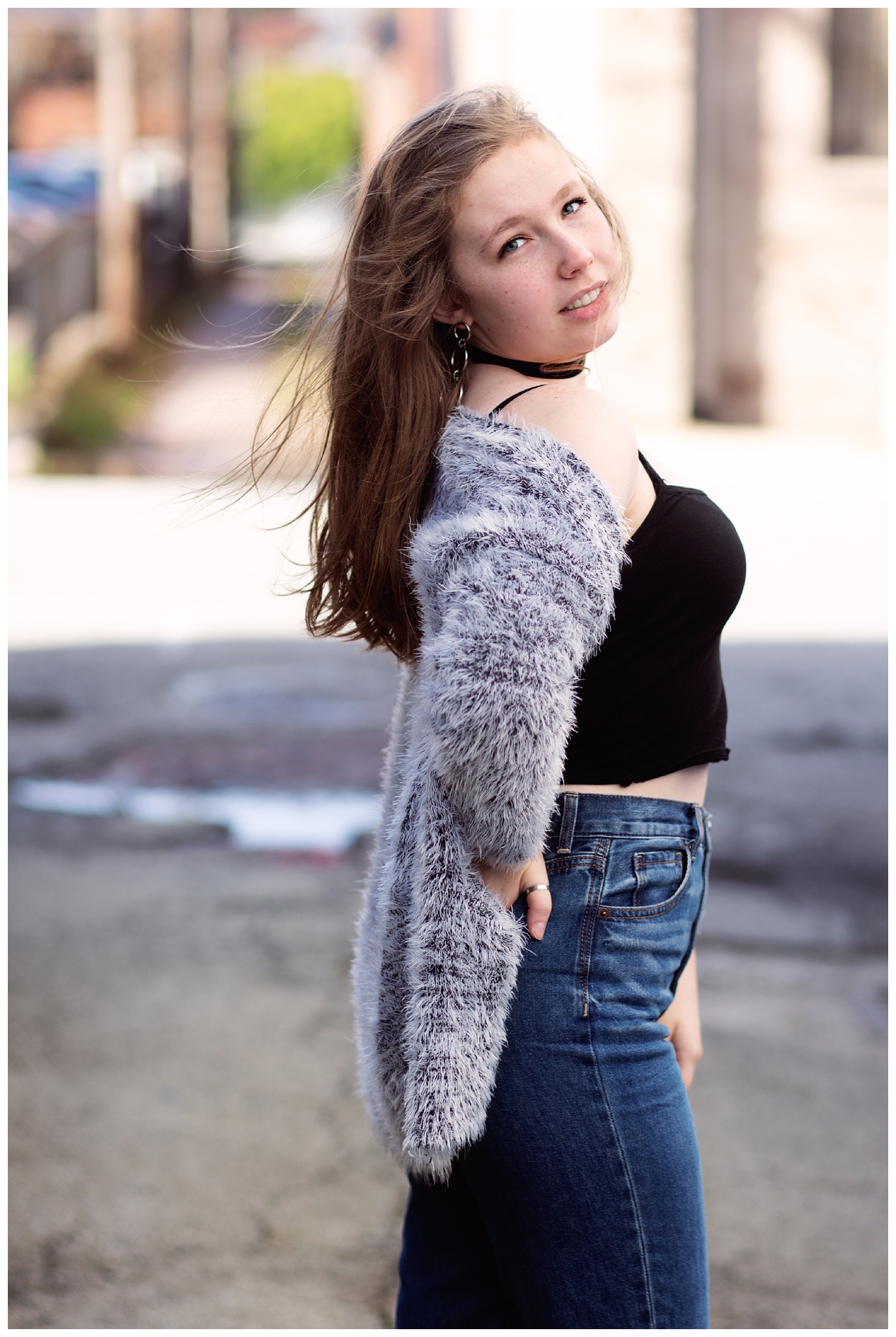 High School Senior Girl standing in Louisville's Nulu Area.