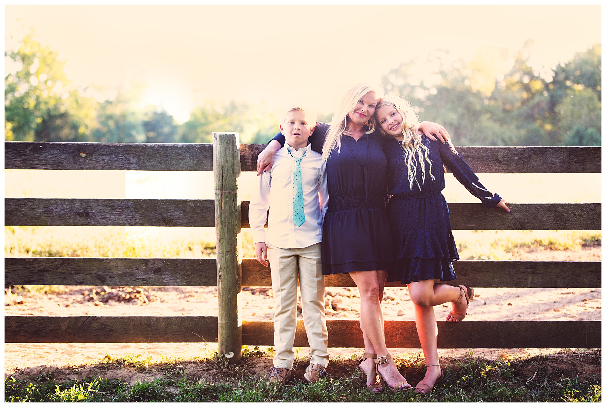 Family standing in front of fence at Blackacre Farm in Louisville